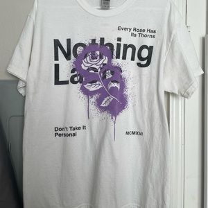White shirt that says Nothing last on it